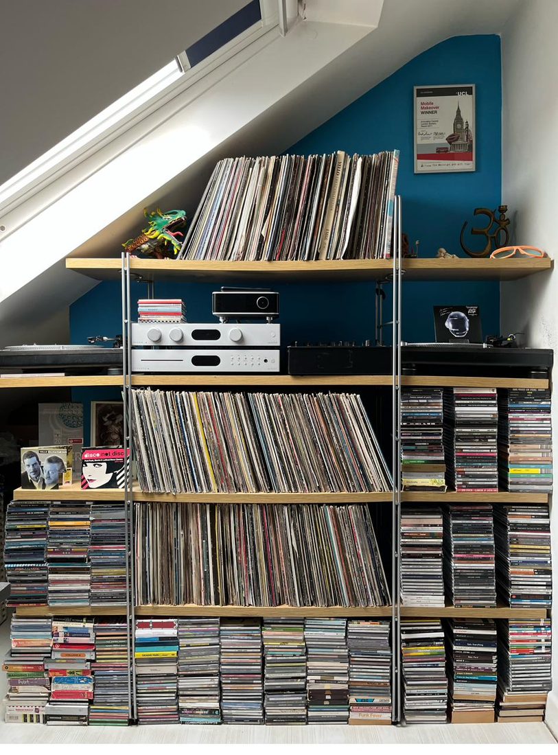 Anil's record and CD collection on shelves with hi-fi and turntables