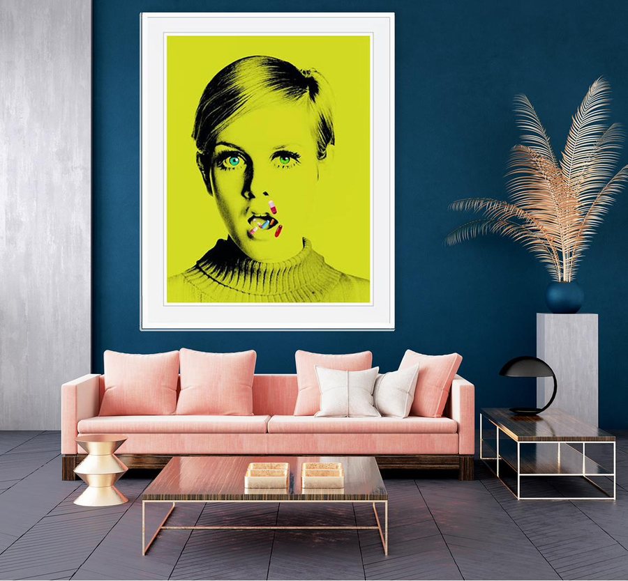 The same print at statement size above a pink sofa